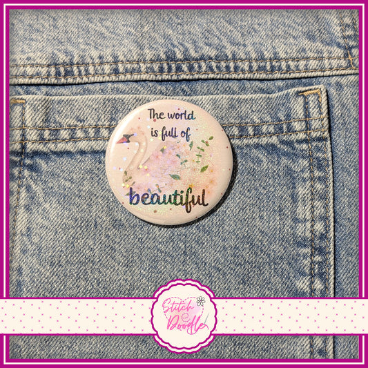 'The world is full of beautiful' large pin badge.  Holographic Finish.  58mm (2.25")