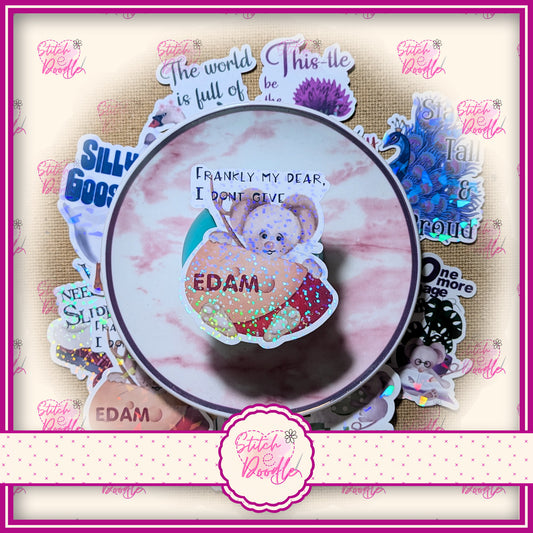 1 x Whimsical XL sticker.  'Frankly my dear I don't give Edam'  Strong and durable with holographic finish.