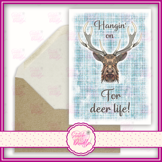 Regal Stag with blue tartan 'Hangin' on for deer life'.  A6 Greeting Card and Envelope.