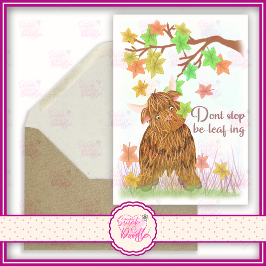 Hamish the highland cow. 'Don't stop in be-leaf-ing'.  A6 Greeting Card and Envelope.